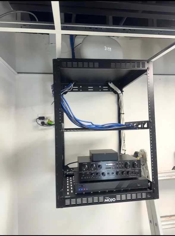 Wall-mounted audio and network equipment rack