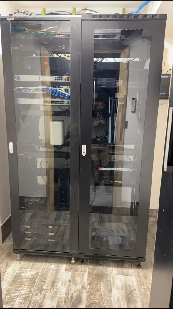 Full-height enclosed network cabinet
