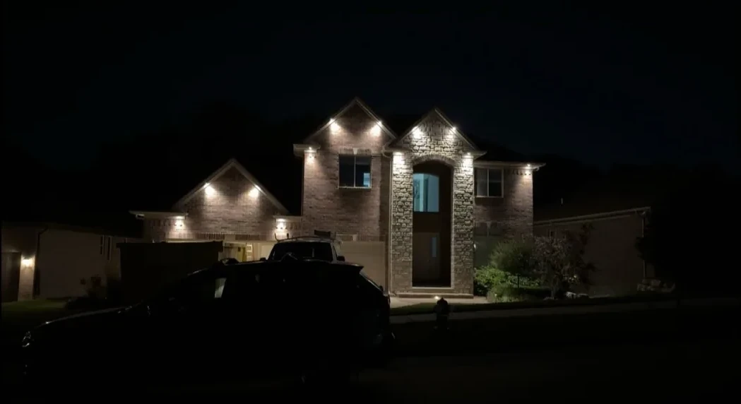 Home with completed architectural lighting at night